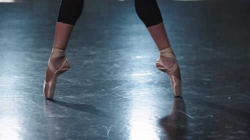 Professional Woman Ballerina Walking on the Tips of Her Pointe Shoes in the Studio