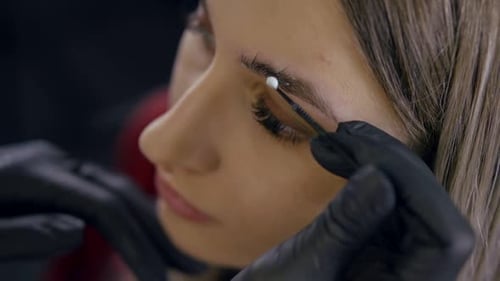 Makeup Artist Doing Eyebrows Lamination.