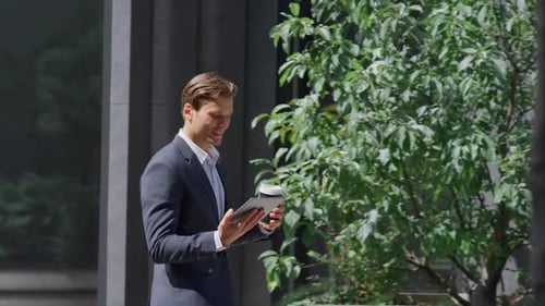Relaxed Finance Manager Moving Playing Video Games in Modern Gray Workplace Yard