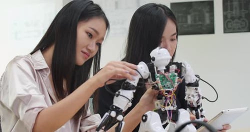 Young girl collaborating development robot