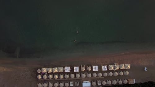 Beach with Sunbeds and People Swimming To the Shore, Aerial