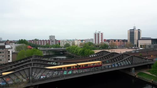 Fly Over Steel Bridge Over River in City
