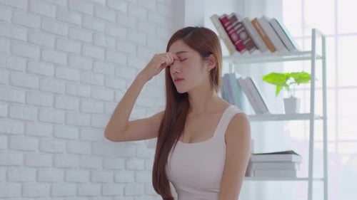 Woman With Headache Indoors