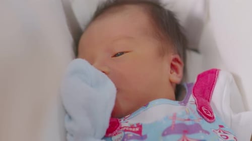 Infant Lying in Crib with Eyes Open