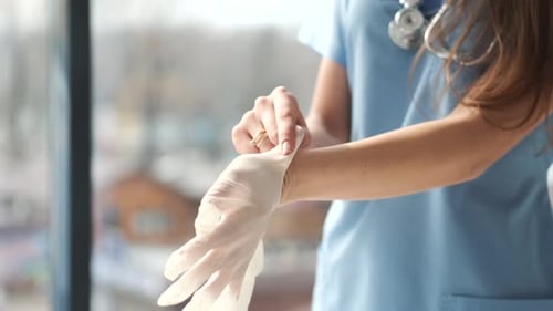 Putting On Sterile Gloves In A Medical Setting