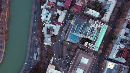 Skyscraper And Traffic By The River