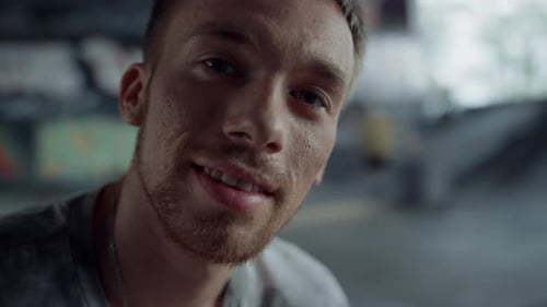 Handsome Man Looking Camera at Skatepark
