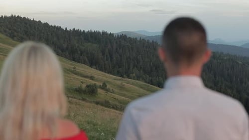 Loving Couple Admiring Mountain View