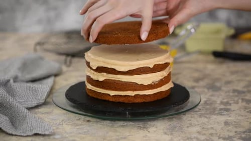 Girl Making a Caramel Cake in a Bakery