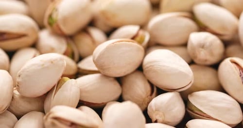Heap of Tasty Pistachios in Shells Close Up