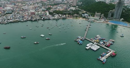 Aerial view of speed boats on the sea near beach city