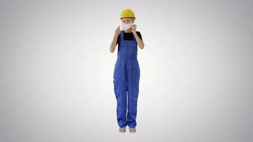 Worker puts on Face Mask for Safety