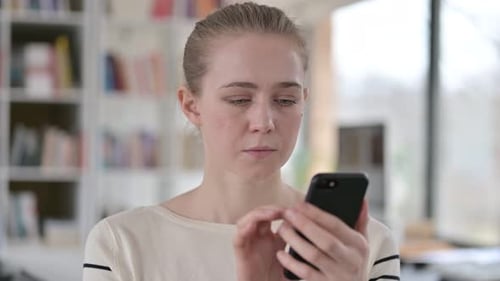 Woman Using Mobile Phone Indoors Close Up