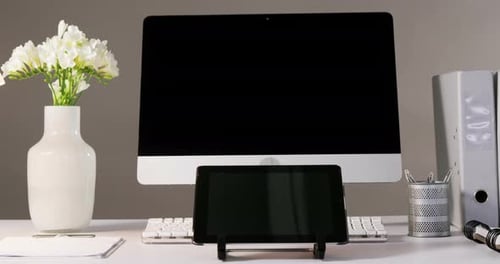 Clean Desktop Setup with Computer and Tablet