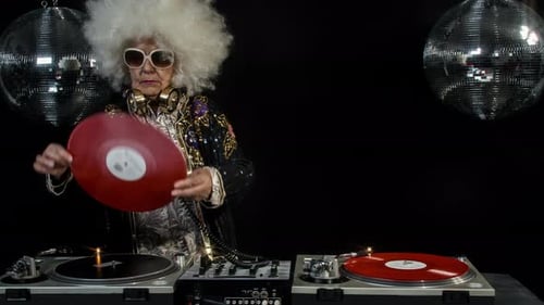 Senior Woman DJing with Mirror Balls and Afro Wig