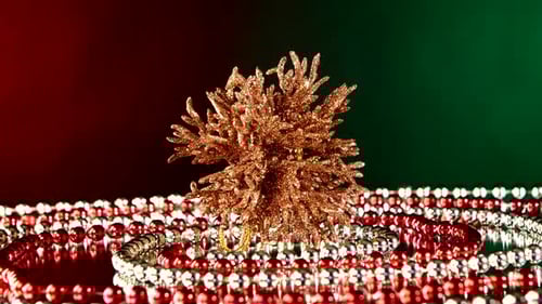 Unusual Coral Toy for Christmas or New Year and Beads, Rotation, on Red and Green, Reflection