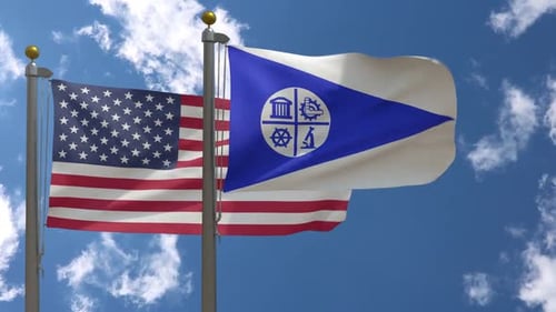 American and City Flag Waving Together on Flagpoles