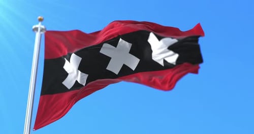 Waving Flag of Amsterdam City against Blue Sky