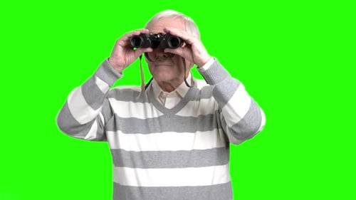 Elderly Man Looking Through Binoculars