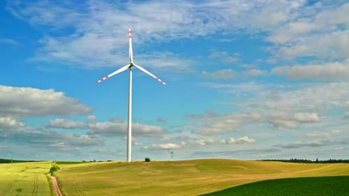 Wind turbines on green field in summer Poland, view from above