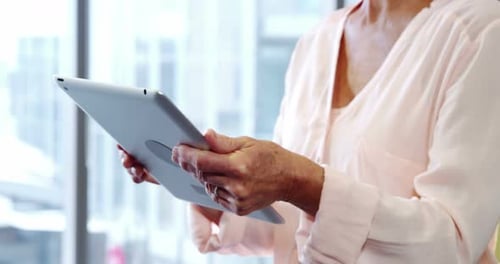 Senior Adult Using a Tablet Device Indoors