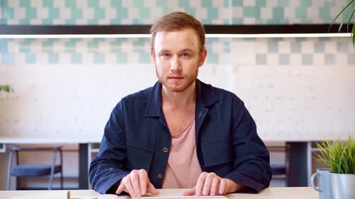 Man Typing on Keyboard in Workplace
