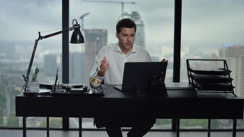 Businessman Talking By Video Call in Office. Man Using Computer for Online