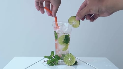 Preparing a Refreshing Lime and Mint Drink