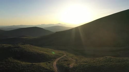 Sunrise Over Lush Green Mountain Landscape