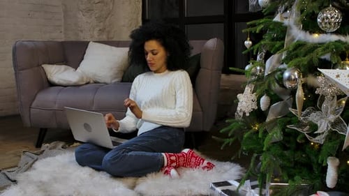 Portrait of African American Woman Working Remotely on Her Laptop
