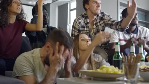 Friends Watch an Intense Game Together at Home
