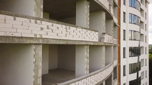 Rooms interior of new apartment building facade under construction.