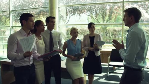 Diverse Team Celebrates Success Together in Office