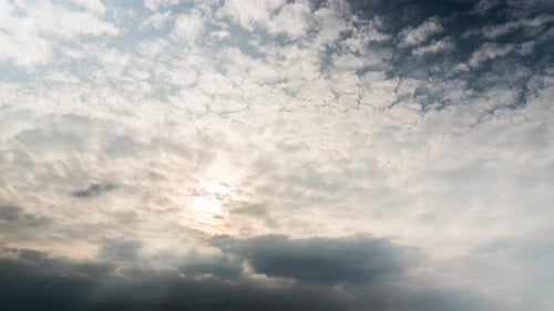 Partly cloudy skies at sunrise, time-lapse