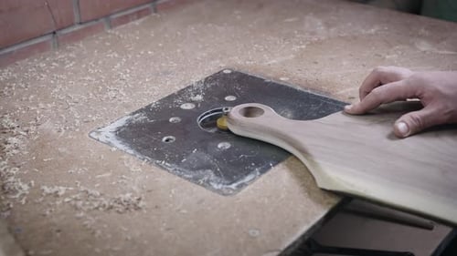 Woodworker Using Shaping Machine on Cutting Board