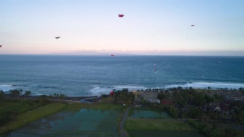 Kites Fly on the Ocean Shore Near the Rice Terraces
