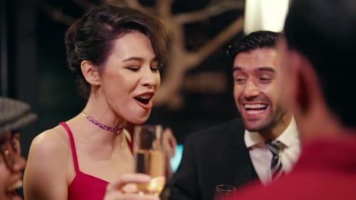 4K Group of people celebrating holiday event with toasting champagne glasses together at luxury bar