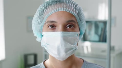 Medical Professional Wearing Surgical Cap and Mask