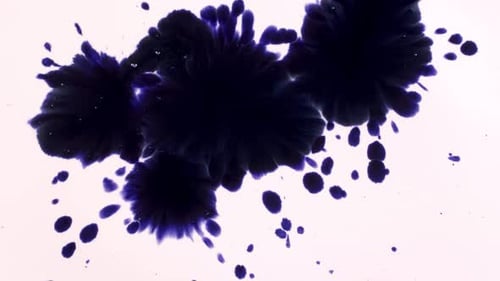 Abstract Blue Ink Blots Expanding on White Surface