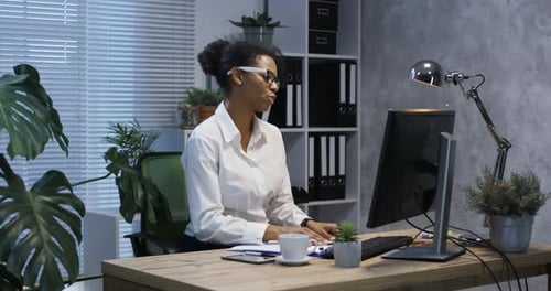 Young Woman Video Chatting in Office