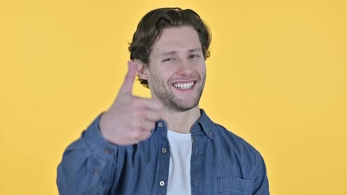 Young Adult Male Giving a Thumbs Up Sign