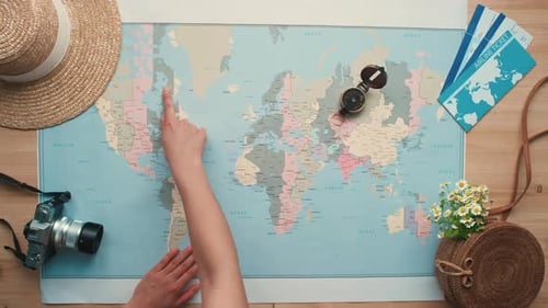 Woman Plans Global Travels with Map