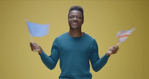 Young Adult Comparing EU and UK Flags