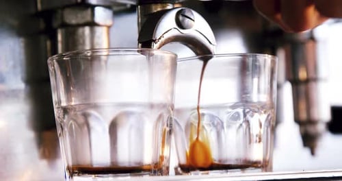 Close-up of espresso pouring from coffee machine