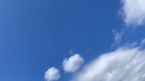 Blue Sky with Fluffy White Clouds