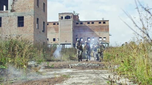 Tactical Team Advances Through War-Torn Urban Ruins