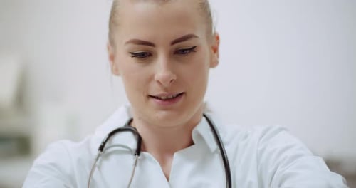 Close Up of Female Doctor Wearing Gloves