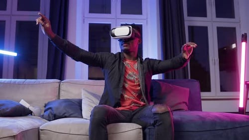 Man Experiencing Virtual Reality Headset on Couch