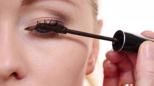 Woman Applies Mascara in a Close-Up Beauty Shot
