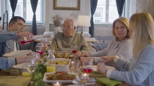 Family Sharing Meal Together at Table